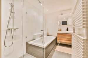 a newly remodeled bathroom with elegant walk-in shower and soaker tub 